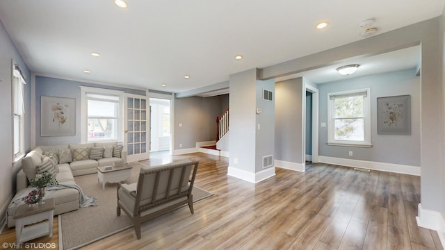 666 Greenview Ave, Des Plaines, IL 60016 - living room featuring stairway, healthy amount of natural light, light wood-style floors, baseboards, and recessed lighting