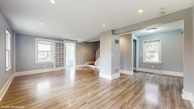 666 Greenview Ave, Des Plaines, IL 60016 - unfurnished living room featuring stairway, light wood-style floors, baseboards, and recessed lighting