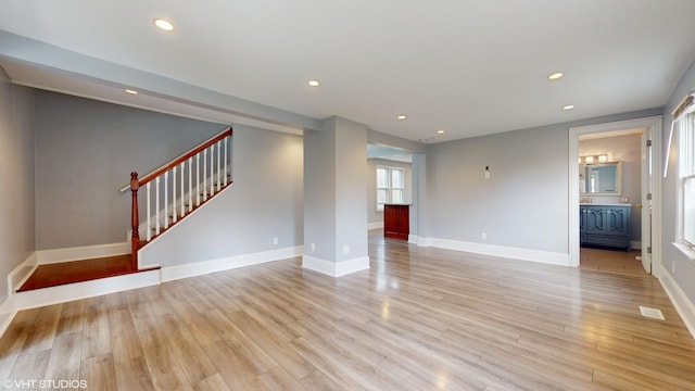 666 Greenview Ave, Des Plaines, IL 60016 - unfurnished living room featuring stairway, light wood-type flooring, recessed lighting, and baseboards