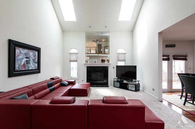 3713 Ballantrae Way, Flossmoor, IL 60422 - living room featuring a high ceiling, plenty of natural light, a skylight, a tile fireplace, and carpet floors