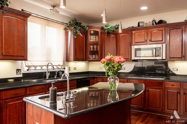 3713 Ballantrae Way, Flossmoor, IL 60422 - kitchen with appliances with stainless steel finishes, an island with sink, glass insert cabinets, a sink, and dark brown cabinets