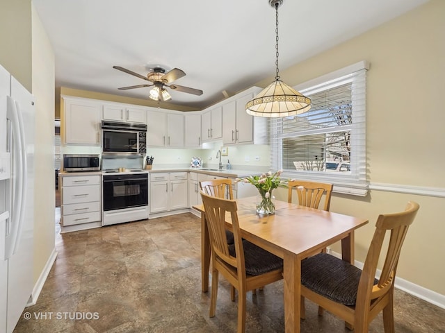 985 W Firestone Dr, Hoffman Estates, IL 60192 - kitchen featuring white appliances, a sink, white cabinets, light countertops, and ceiling fan