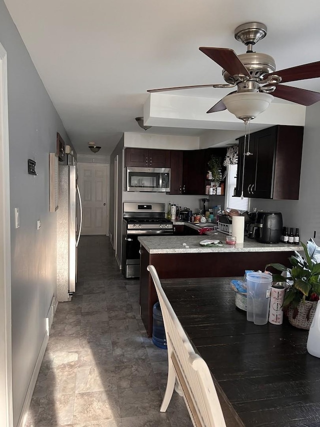 10014 S Aberdeen St, Chicago, IL 60643 - kitchen with appliances with stainless steel finishes, baseboards, a peninsula, ceiling fan, and dark brown cabinets