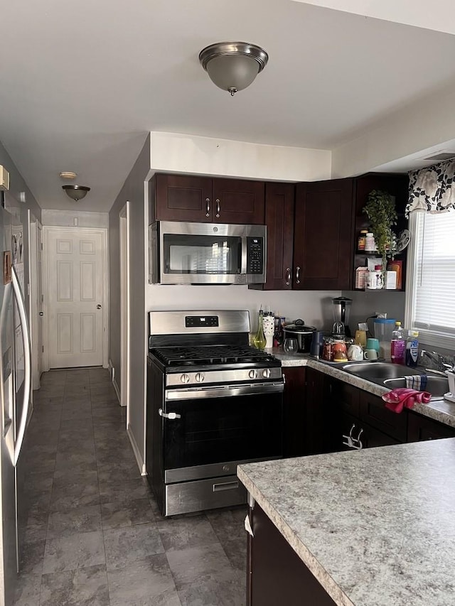 10014 S Aberdeen St, Chicago, IL 60643 - kitchen with stainless steel appliances, a sink, dark brown cabinets, and light countertops