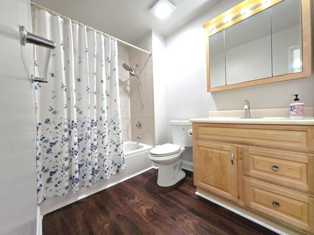 1750 Ridgewood Ln, Hoffman Estates, IL 60192 - bathroom with wood finished floors, shower / tub combo with curtain, toilet, and vanity