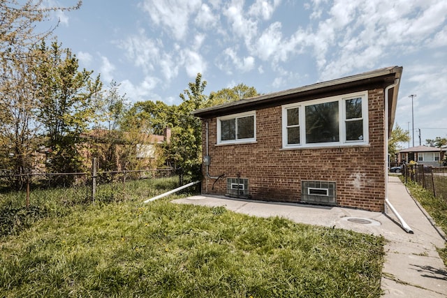 9314 S Perry Ave, Chicago, IL 60620 - back of property with brick siding and a patio area
