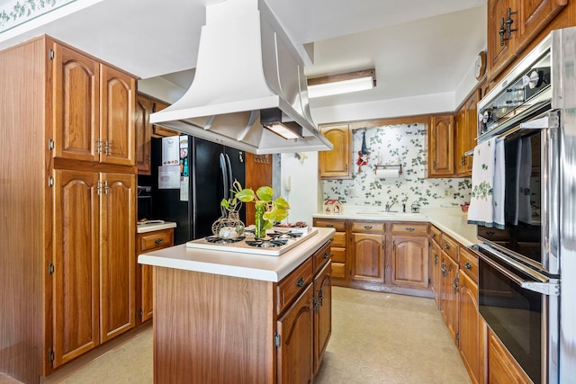 428 Julia St, Lemont, IL 60439 - kitchen featuring white gas cooktop, freestanding refrigerator, island exhaust hood, light countertops, and light floors