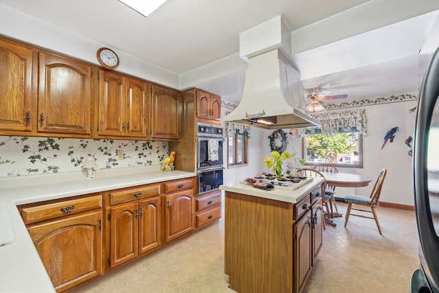 428 Julia St, Lemont, IL 60439 - kitchen featuring island range hood, ceiling fan, brown cabinetry, and light countertops
