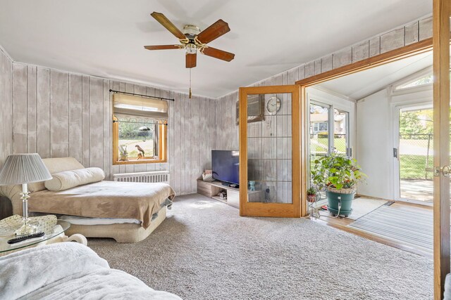 428 Julia St, Lemont, IL 60439 - living area featuring a ceiling fan, french doors, wood walls, lofted ceiling, and radiator