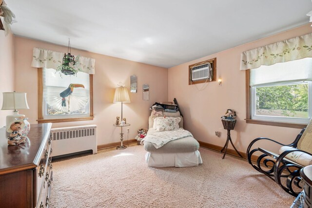 428 Julia St, Lemont, IL 60439 - sitting room featuring radiator heating unit, a wall mounted AC, carpet flooring, and baseboards