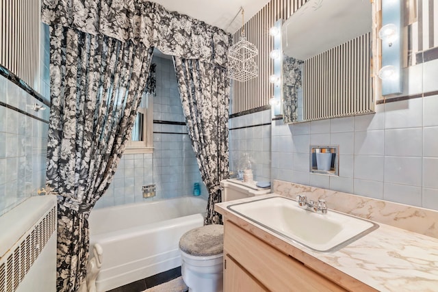 428 Julia St, Lemont, IL 60439 - bathroom featuring toilet, tile walls, shower / tub combo with curtain, vanity, and radiator heating unit