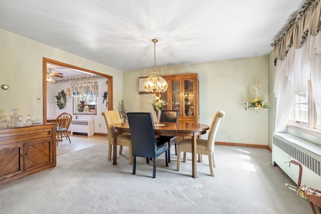 428 Julia St, Lemont, IL 60439 - dining room with radiator, a chandelier, and light carpet
