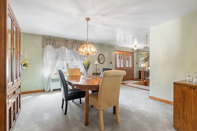 428 Julia St, Lemont, IL 60439 - dining area featuring light colored carpet, baseboards, a chandelier, and radiator