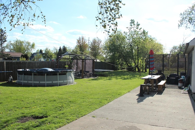view of yard featuring a gazebo, a patio area, and outdoor dining space