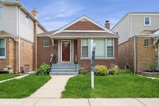6119 S Melvina Ave, Chicago, IL 60638 - view of front facade with brick siding, a front yard, roof with shingles, and a chimney