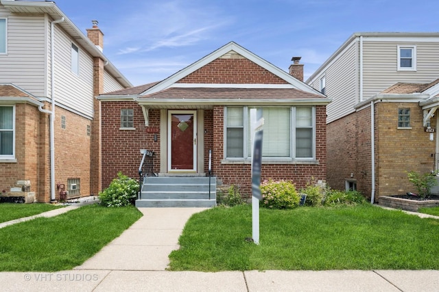 6119 S Melvina Ave, Chicago, IL 60638 - view of front of home featuring brick siding, a front yard, roof with shingles, and a chimney