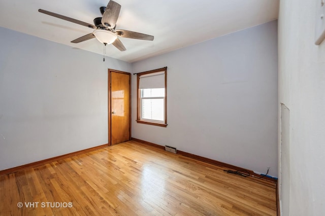 6119 S Melvina Ave, Chicago, IL 60638 - unfurnished room with light wood-style floors and a ceiling fan