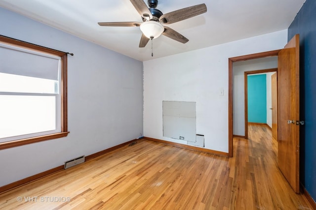 6119 S Melvina Ave, Chicago, IL 60638 - spare room with wood finished floors and a ceiling fan