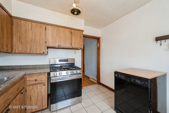 6119 S Melvina Ave, Chicago, IL 60638 - kitchen featuring stainless steel gas stove, black dishwasher, light tile patterned floors, and brown cabinets