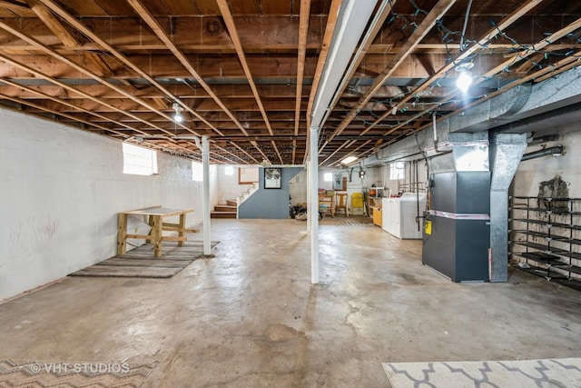 6119 S Melvina Ave, Chicago, IL 60638 - basement featuring washing machine and dryer, stairs, heating unit, and healthy amount of natural light
