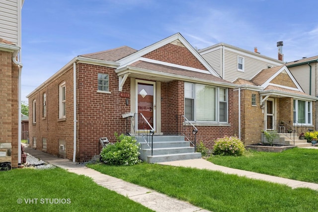 6119 S Melvina Ave, Chicago, IL 60638 - view of front of property featuring brick siding, a front yard, and a shingled roof