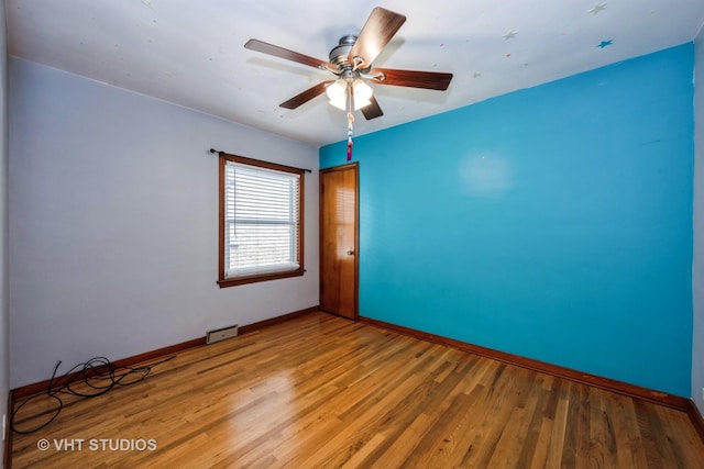 6119 S Melvina Ave, Chicago, IL 60638 - spare room with light wood-style floors and a ceiling fan