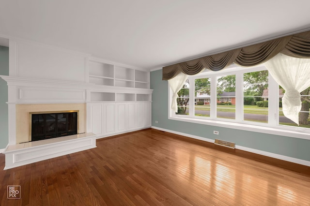 902 E Plate Dr, Palatine, IL 60074 - unfurnished living room with hardwood / wood-style floors, a high end fireplace, and built in features