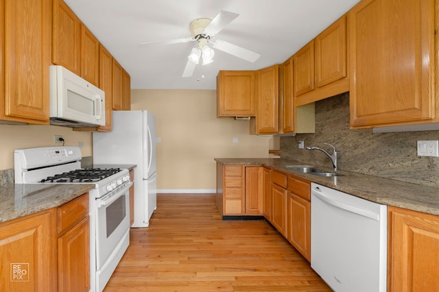 902 E Plate Dr, Palatine, IL 60074 - kitchen with white appliances, light wood-type flooring, light stone countertops, backsplash, and ceiling fan