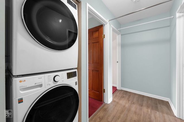 902 E Plate Dr, Palatine, IL 60074 - laundry room with stacked washing machine and dryer and wood finished floors