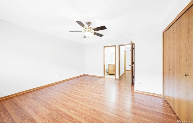 16052 Eagle Ridge Dr, Tinley Park, IL 60477 - unfurnished bedroom with light wood-type flooring, a closet, baseboards, and a ceiling fan