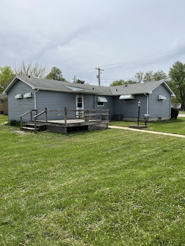 1112 1st Ave, Ottawa, IL 61350 - back of house featuring a deck, a lawn, and central AC unit
