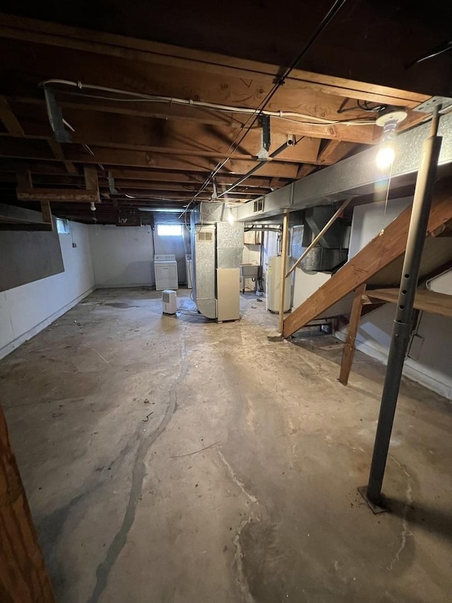 1112 1st Ave, Ottawa, IL 61350 - below grade area featuring heating unit and washer / clothes dryer