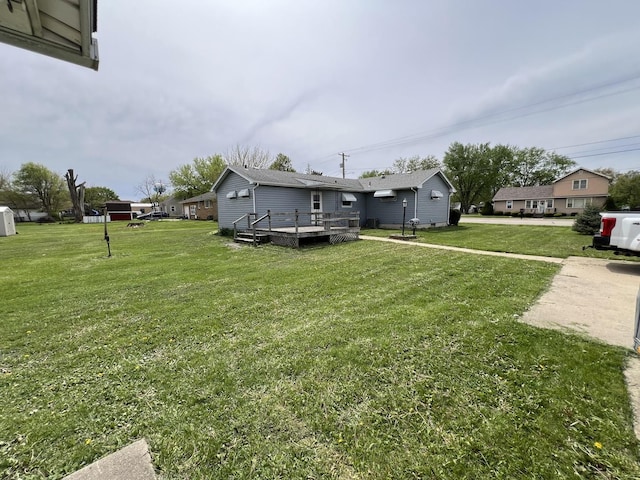 1112 1st Ave, Ottawa, IL 61350 - view of green lawn with a wooden deck