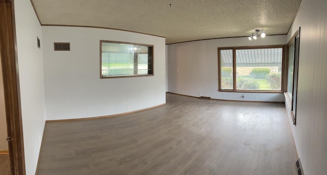 1112 1st Ave, Ottawa, IL 61350 - unfurnished room featuring wood finished floors, a textured ceiling, baseboards, and crown molding