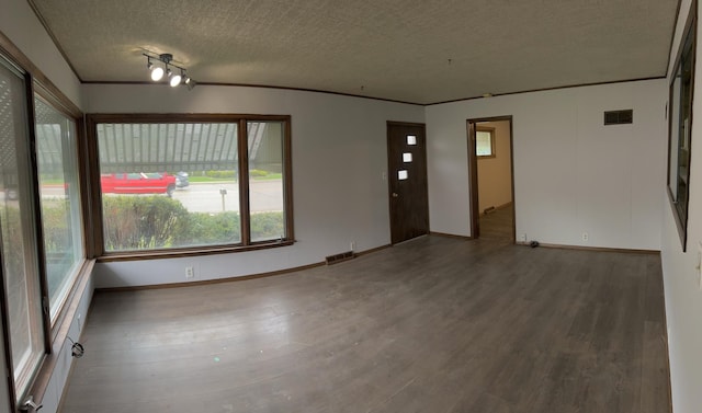 1112 1st Ave, Ottawa, IL 61350 - unfurnished room with wood finished floors, healthy amount of natural light, a textured ceiling, and baseboards