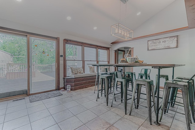 25647 W Old Grand Ave, Ingleside, IL 60041 - dining space featuring vaulted ceiling, light tile patterned floors, a chandelier, recessed lighting, and arched walkways