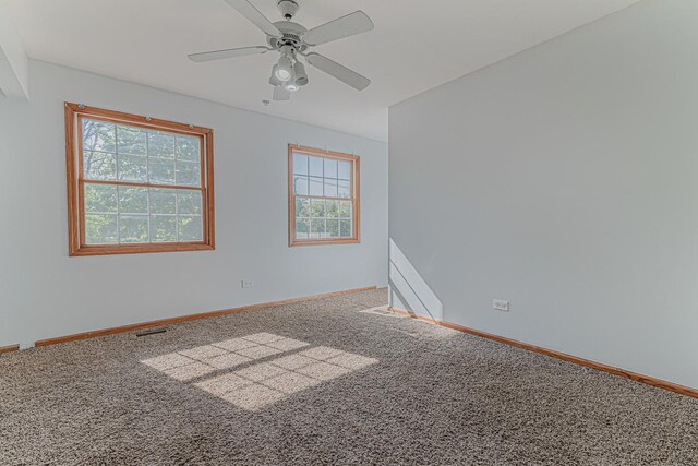 25647 W Old Grand Ave, Ingleside, IL 60041 - unfurnished room with carpet, baseboards, and a ceiling fan