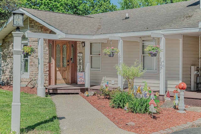 25647 W Old Grand Ave, Ingleside, IL 60041 - doorway to property with a shingled roof, a porch, and stone siding