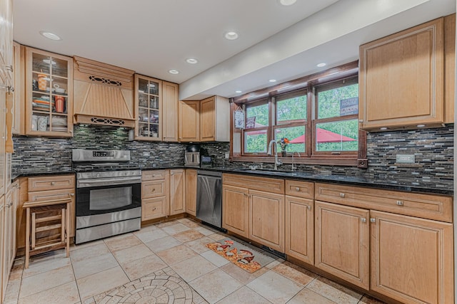 25647 W Old Grand Ave, Ingleside, IL 60041 - kitchen with stainless steel appliances, a sink, backsplash, premium range hood, and recessed lighting