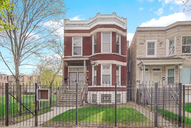 7223 S Union Ave, Chicago, IL 60621 - view of front of house with a fenced front yard, stone siding, and a gate