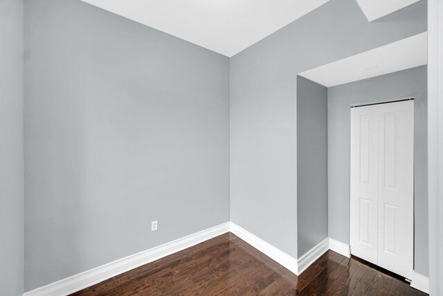 7223 S Union Ave, Chicago, IL 60621 - unfurnished room featuring dark wood-type flooring and baseboards