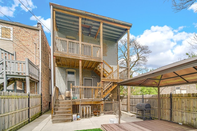 7223 S Union Ave, Chicago, IL 60621 - rear view of property with stairway, a fenced backyard, a wooden deck, and a gazebo