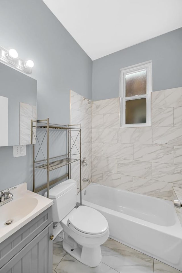 7223 S Union Ave, Chicago, IL 60621 - bathroom with marble look tiles, toilet, bathing tub / shower combination, and vanity