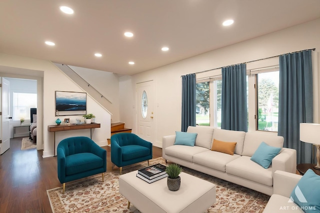 living area with wood finished floors, recessed lighting, stairs, and baseboards