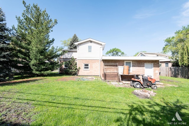 back of property featuring brick siding