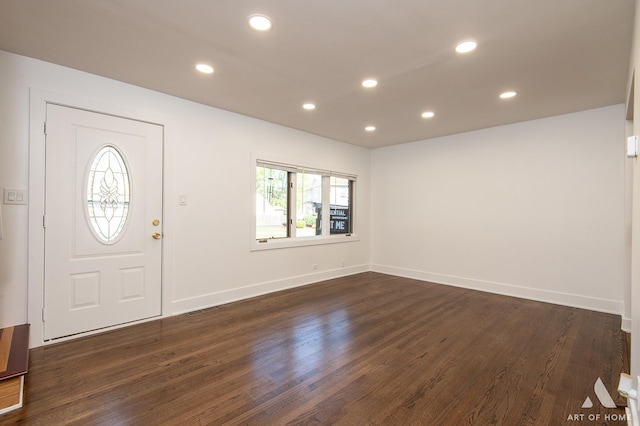 foyer entrance with recessed lighting, dark wood finished floors, and baseboards