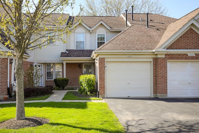 1224 Clearview Ct, Buffalo Grove, IL 60089 - view of front facade featuring brick siding, roof with shingles, driveway, a front lawn, and a garage