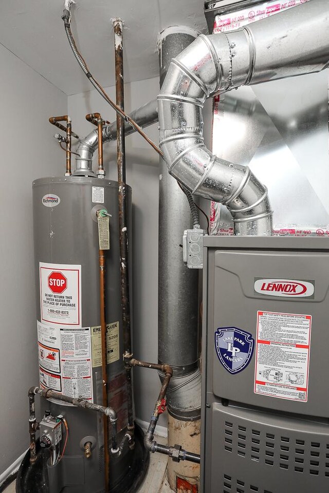 utility room with water heater