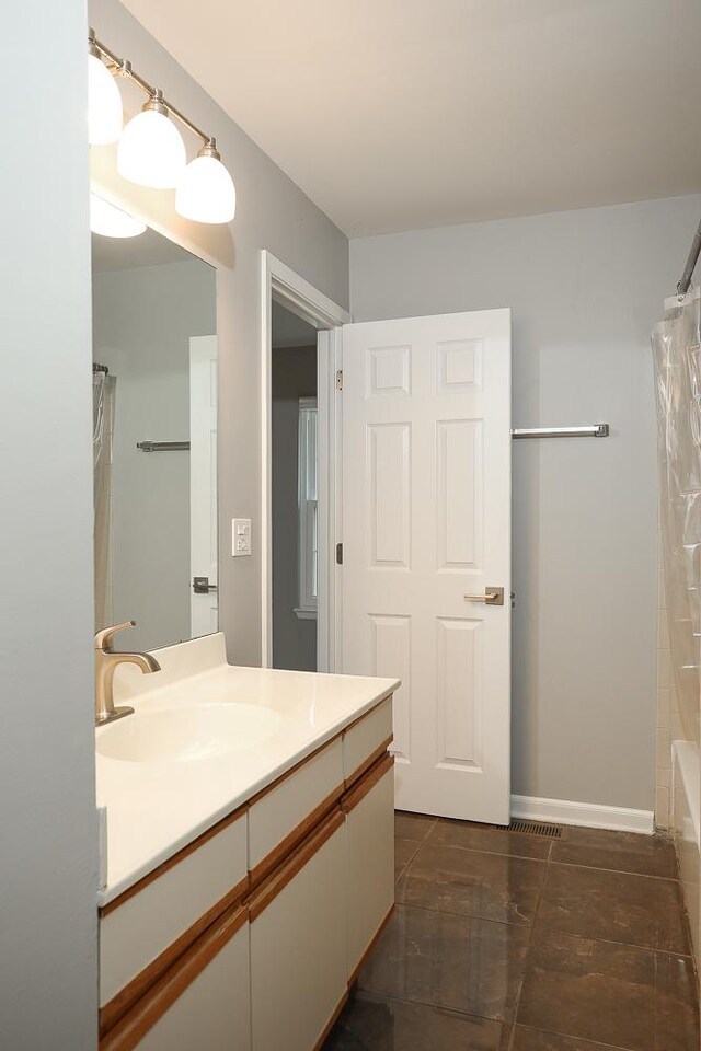 bathroom featuring vanity and tile patterned flooring