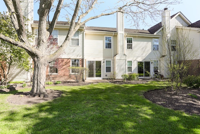 1224 Clearview Ct, Buffalo Grove, IL 60089 - back of house featuring a yard, a chimney, and brick siding
